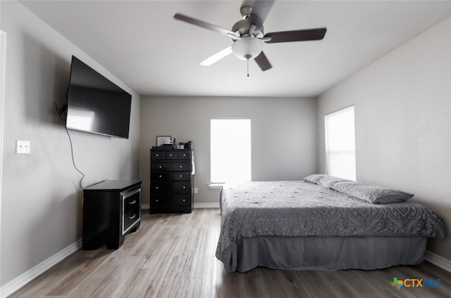 bedroom featuring ceiling fan and light wood-type flooring