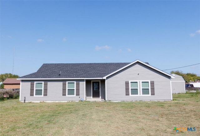 single story home featuring a front yard