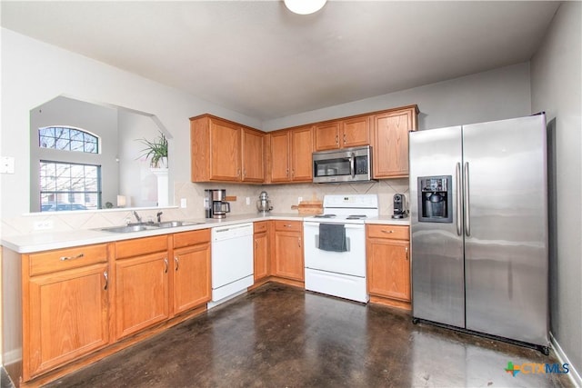 kitchen featuring stainless steel appliances, a sink, finished concrete flooring, light countertops, and tasteful backsplash