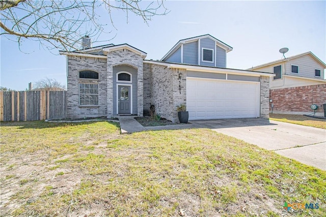 view of front of home featuring a front yard, brick siding, fence, and driveway