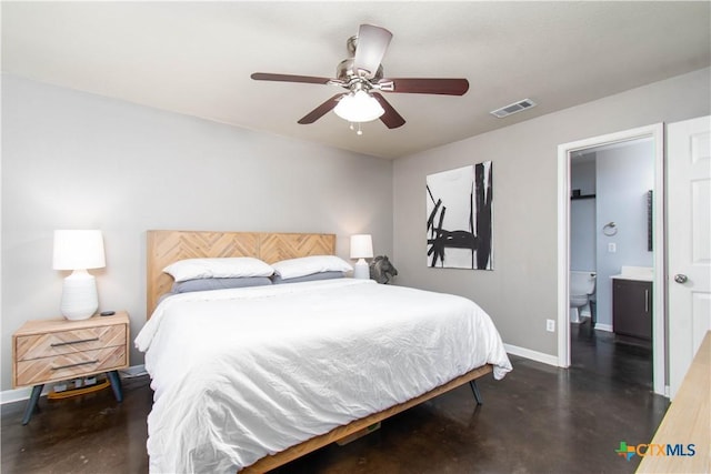 bedroom featuring visible vents, ensuite bathroom, a ceiling fan, concrete flooring, and baseboards