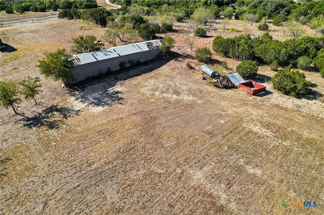 birds eye view of property with a rural view