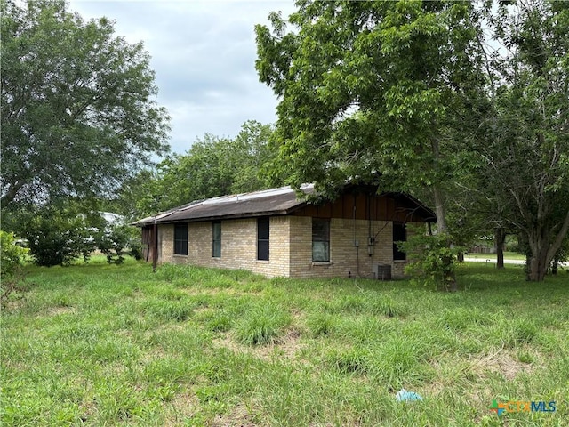 116 S Williams St, Placedo, TX 77977 - view of home's exterior featuring brick siding