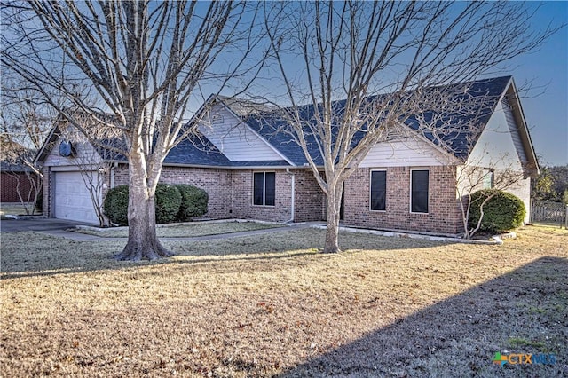 view of front facade with a garage and a front yard