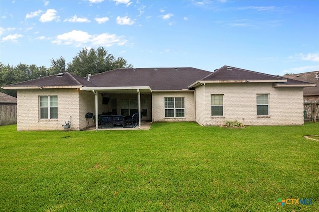 204 Crosswind Dr, Victoria, TX 77904 - back of property with a patio area and brick siding
