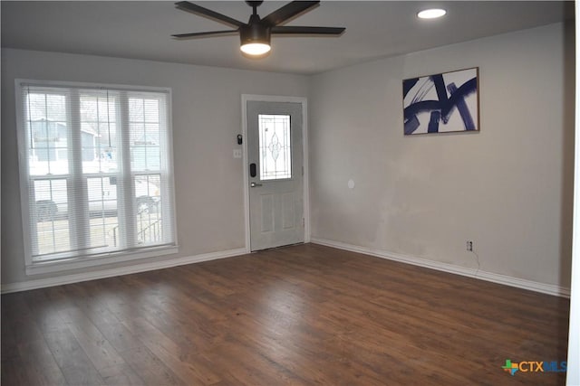 entryway featuring plenty of natural light, dark hardwood / wood-style floors, and ceiling fan