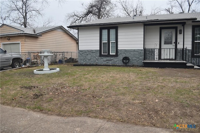 view of property exterior with a lawn