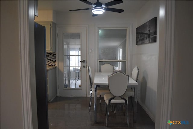 tiled dining room with ceiling fan