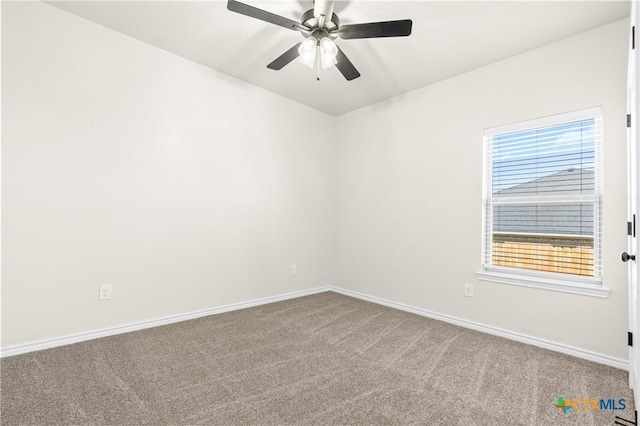 empty room with carpet and ceiling fan