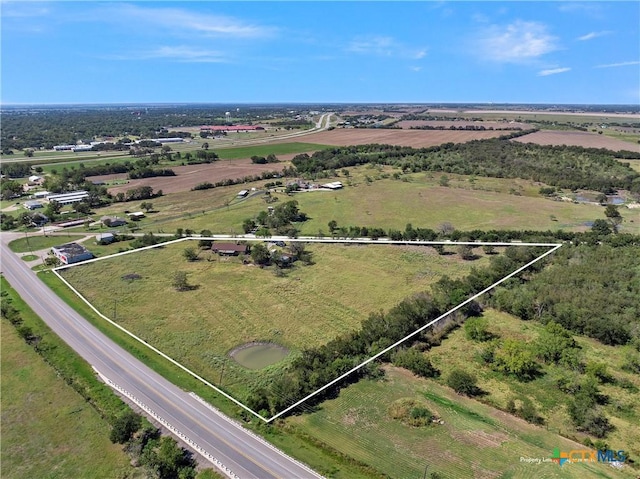 birds eye view of property featuring a rural view