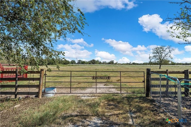 view of gate featuring a rural view