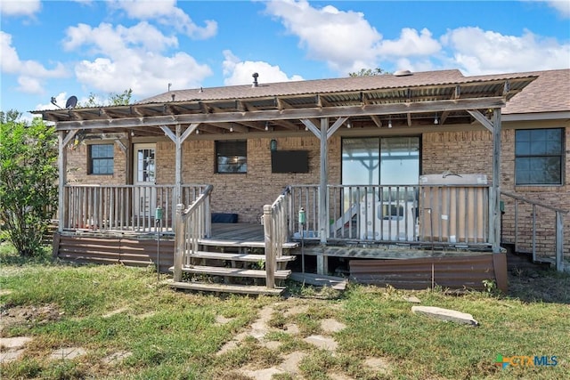 rear view of house with a deck