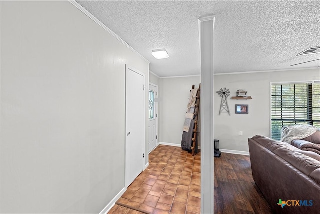 foyer featuring wood-type flooring, a textured ceiling, ceiling fan, and ornamental molding