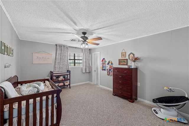 bedroom featuring ceiling fan, crown molding, light colored carpet, and a textured ceiling