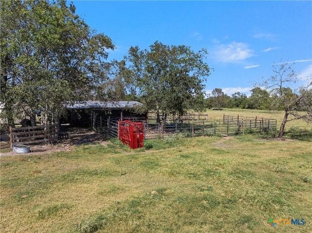 view of yard with a rural view