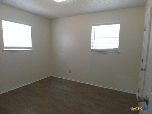507 Hackberry St, Copperas Cove, TX 76522 - unfurnished room featuring dark wood-type flooring and baseboards