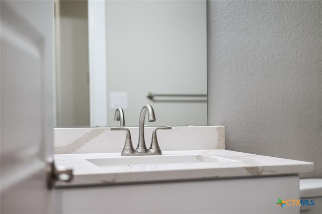 interior details with vanity and toilet