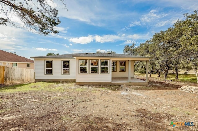 rear view of house with a patio