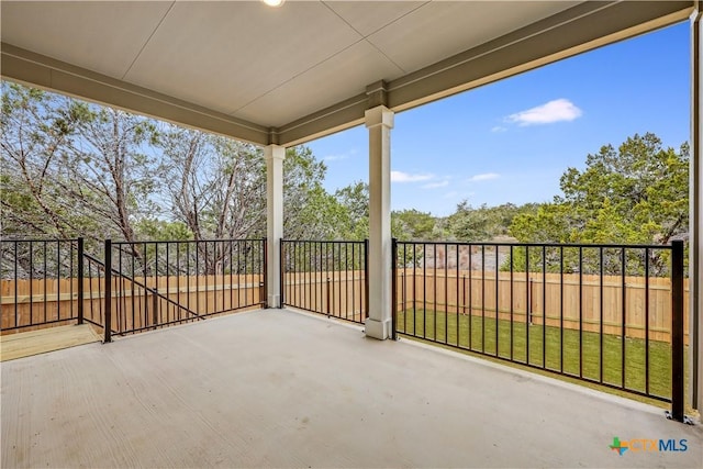 view of patio featuring fence