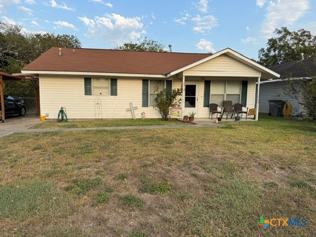 view of front facade with a patio and a front lawn