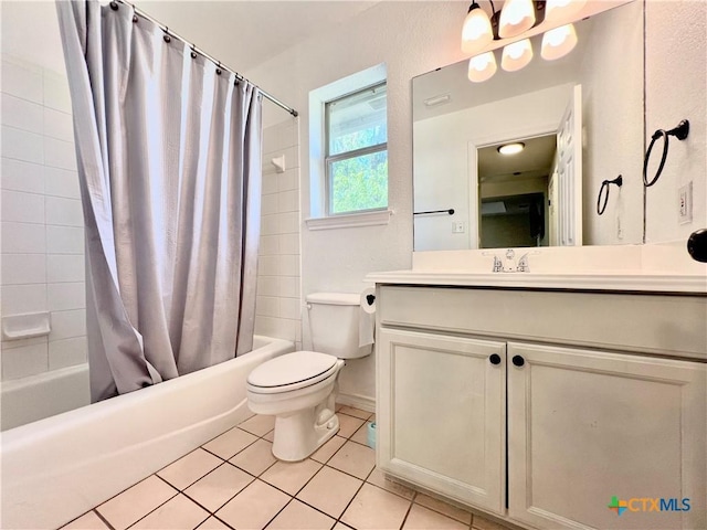 bathroom with shower / tub combo with curtain, toilet, tile patterned floors, and vanity