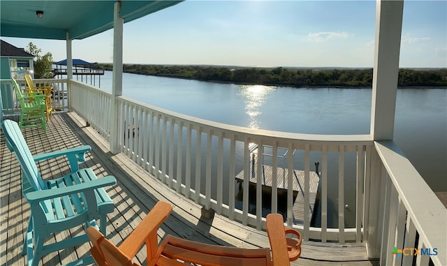 balcony featuring a water view