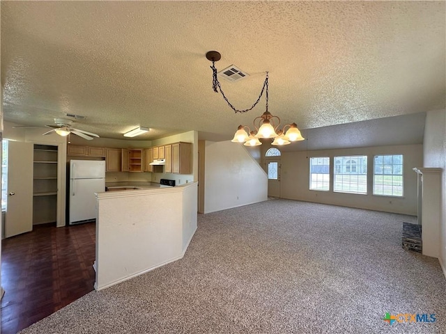 2707 Tripp Trl, Killeen, TX 76543 - kitchen with freestanding refrigerator, a textured ceiling, a chandelier, ceiling fan, and open floor plan