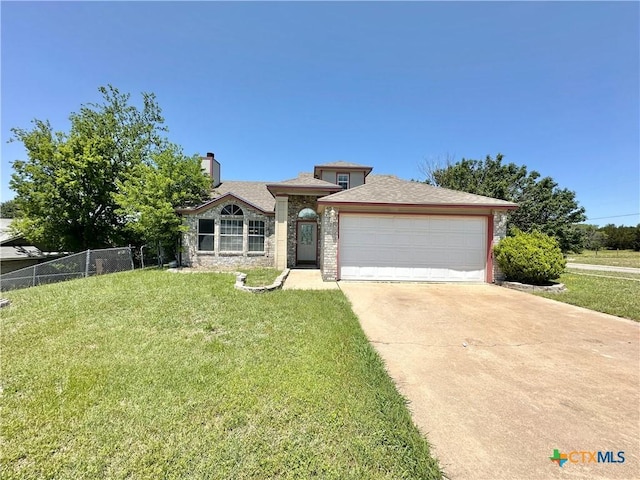 2707 Tripp Trl, Killeen, TX 76543 - view of front of house with driveway, a chimney, and an attached garage