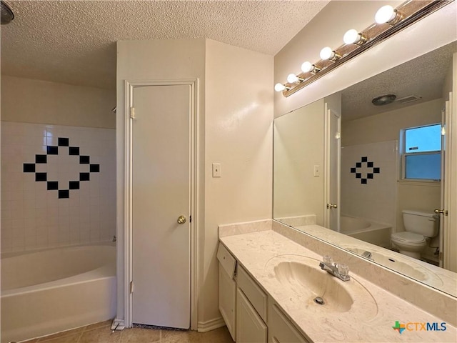 2707 Tripp Trl, Killeen, TX 76543 - full bathroom with a textured ceiling, tile patterned floors, toilet, vanity, and shower / bathtub combination