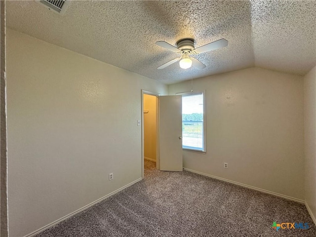 2707 Tripp Trl, Killeen, TX 76543 - carpeted empty room featuring a textured ceiling, a ceiling fan, baseboards, and vaulted ceiling