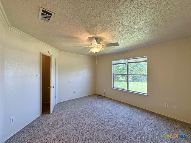 2707 Tripp Trl, Killeen, TX 76543 - spare room featuring a textured ceiling, ornamental molding, carpet floors, a ceiling fan, and baseboards