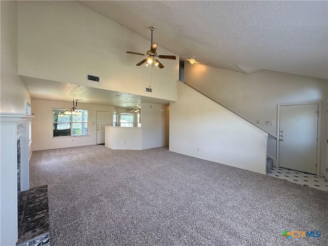 2707 Tripp Trl, Killeen, TX 76543 - unfurnished living room with ceiling fan, a textured ceiling, carpet, a fireplace, and high vaulted ceiling