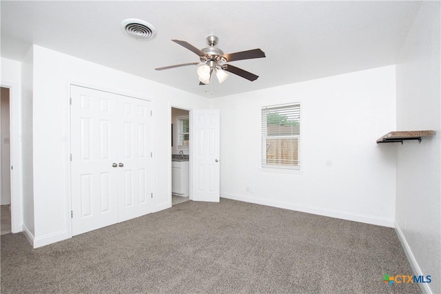 unfurnished bedroom with ceiling fan, a closet, and carpet floors