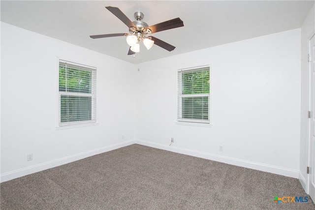 spare room with ceiling fan and carpet floors