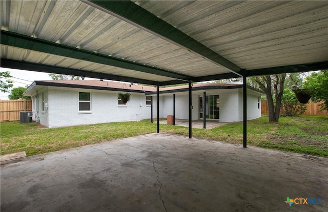 view of patio with central AC and a carport