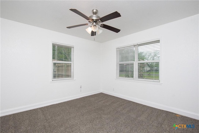 empty room featuring carpet floors and ceiling fan