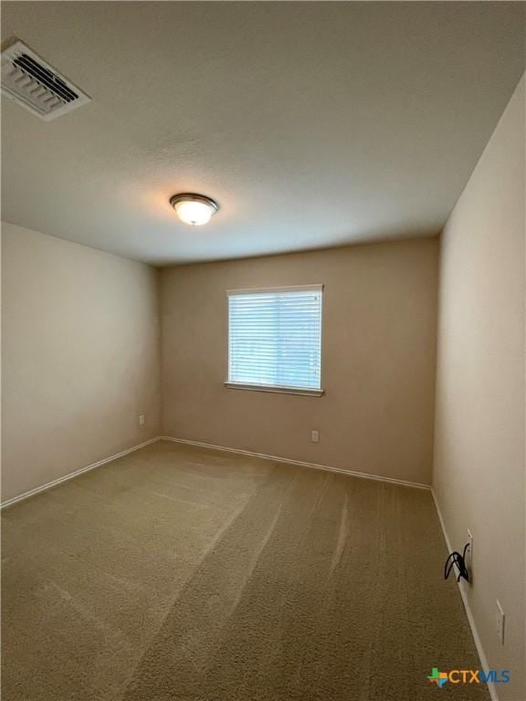 empty room with carpet flooring