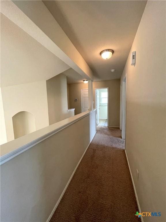 corridor with light colored carpet