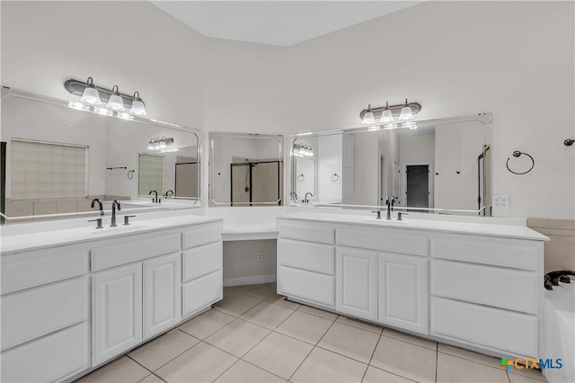 bathroom featuring vanity, tile patterned floors, and an enclosed shower