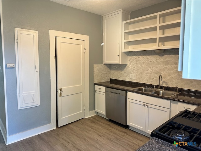 kitchen featuring decorative backsplash, stainless steel dishwasher, sink, dark hardwood / wood-style floors, and white cabinetry