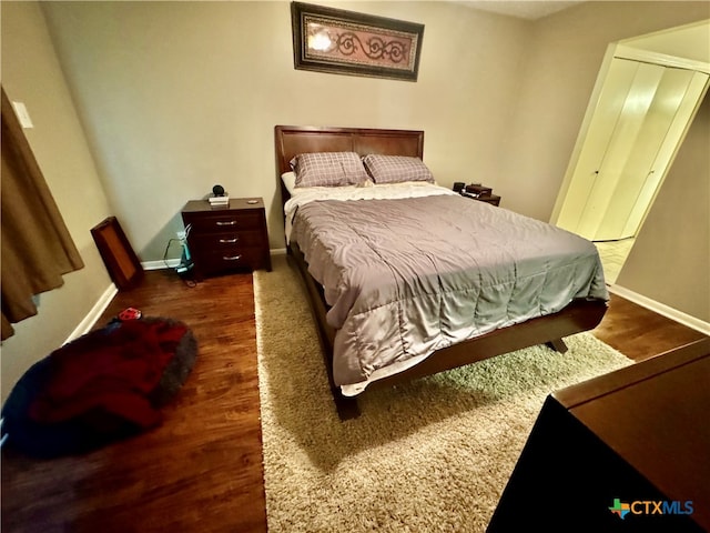 bedroom featuring dark hardwood / wood-style floors