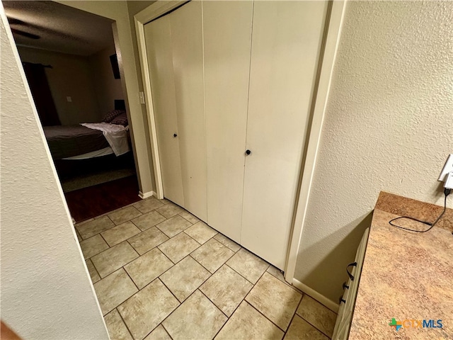 hallway featuring light tile patterned floors