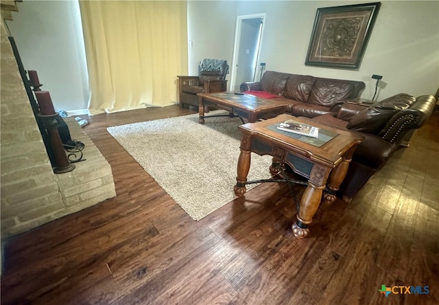 living room featuring dark hardwood / wood-style floors