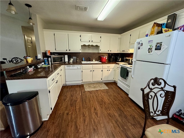 kitchen with dark wood-type flooring, white appliances, white cabinetry, and sink