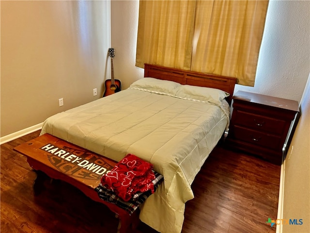 bedroom featuring dark wood-type flooring