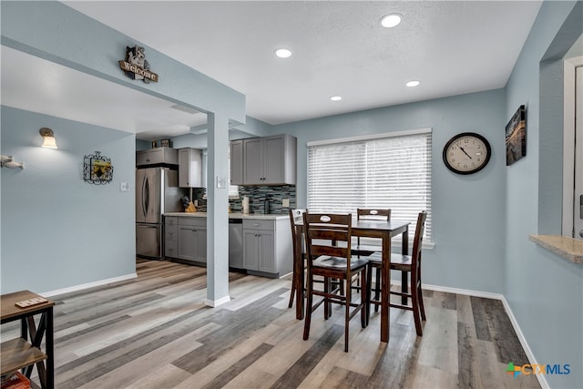 dining room with light wood-type flooring