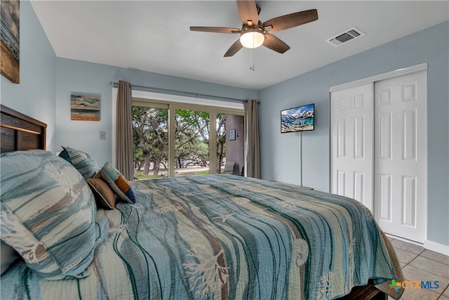 bedroom with ceiling fan, light tile patterned floors, and access to outside