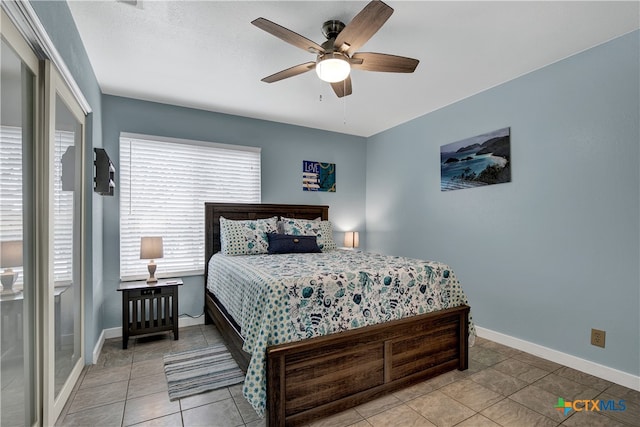 tiled bedroom featuring ceiling fan