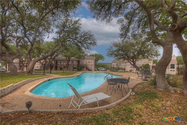 view of pool featuring a patio area