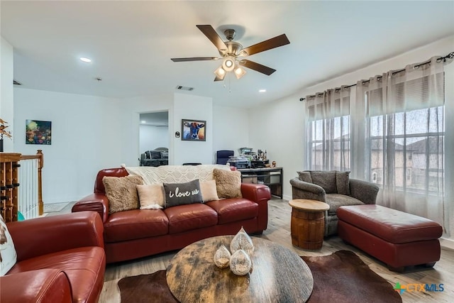 living area featuring ceiling fan, visible vents, wood finished floors, and recessed lighting